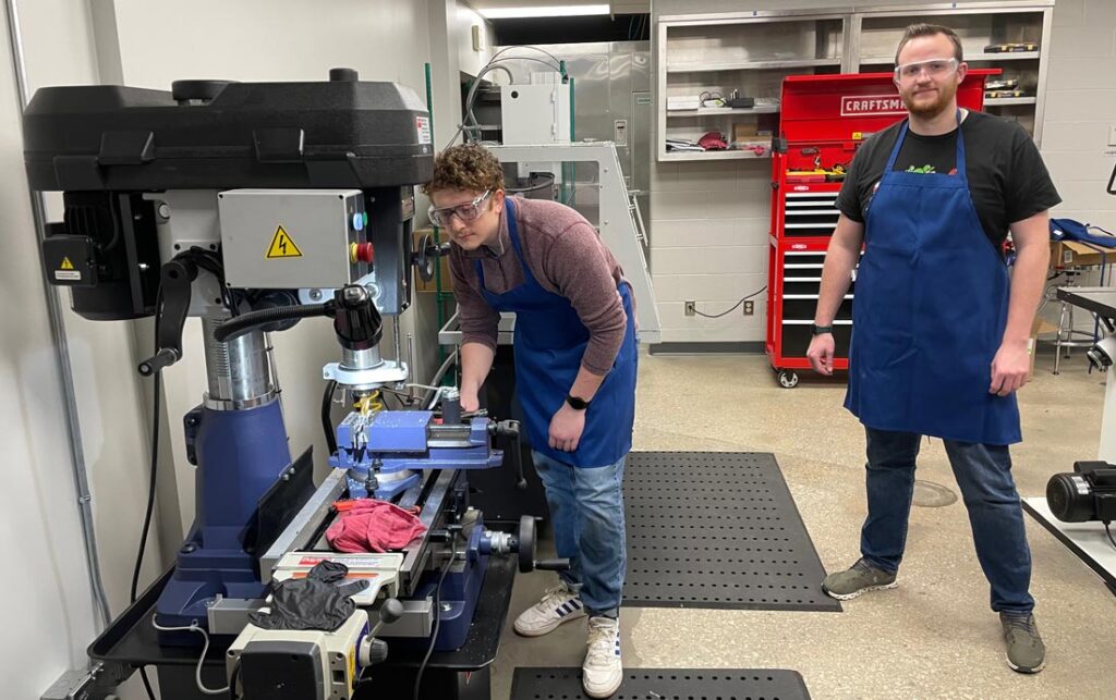 Dayton-Milling-Machine-in-use A technician works on a milling machine.
