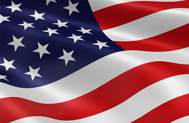 The American flag blowing in wind.