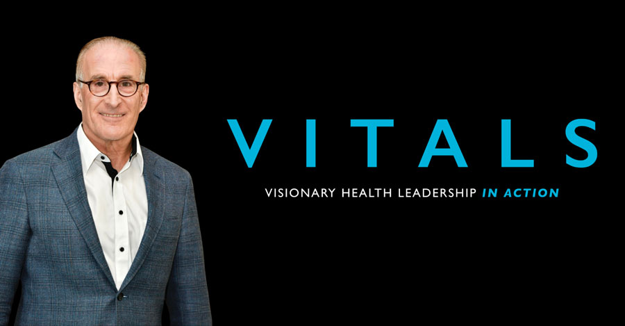 A doctor wearing a coat next to the logo for VITALS.