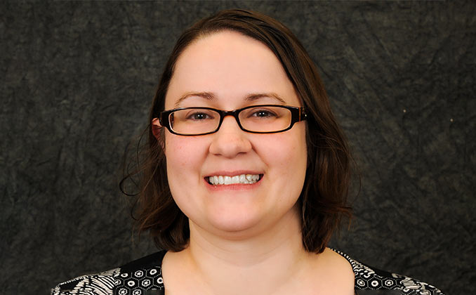 A woman with her hands crossed.