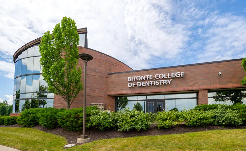 The exterior of the Bitonte College of Dentistry at NEOMED on a summer afternoon.