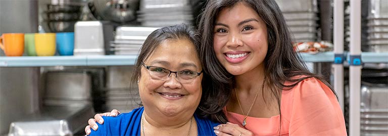A women and her mother in a kitchen.