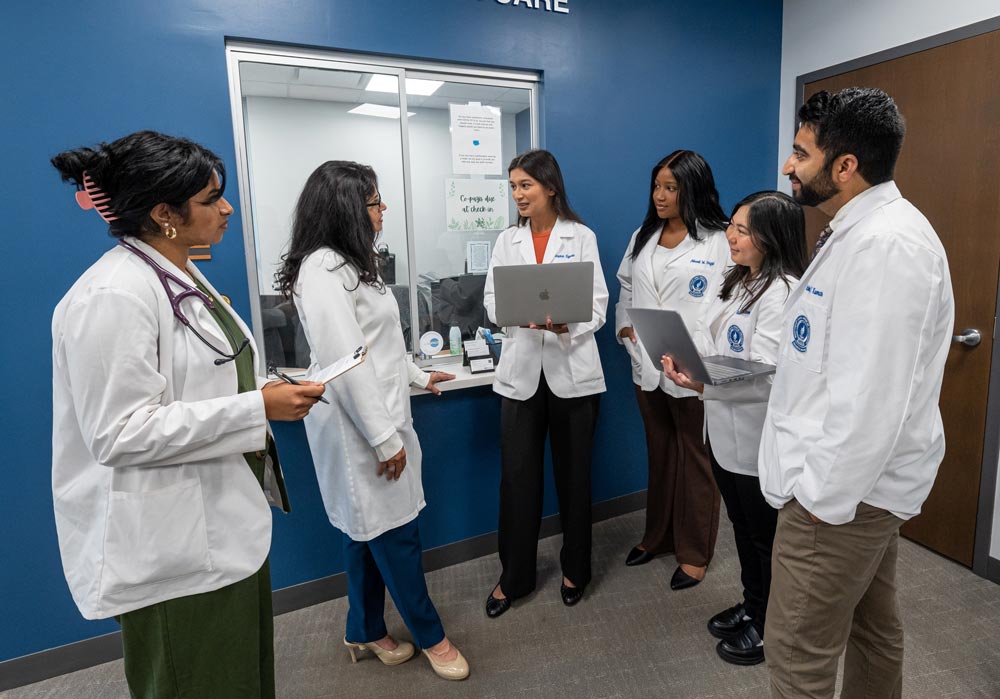 Dr. Ismael consults with five student doctors in the NEOMED Free Clinic.