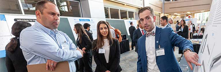 An entrepreneurial student pitching his product concept during a Bench to Bedside event.
