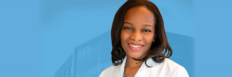 Princess Ogbogu with a NEOMED building in the background.