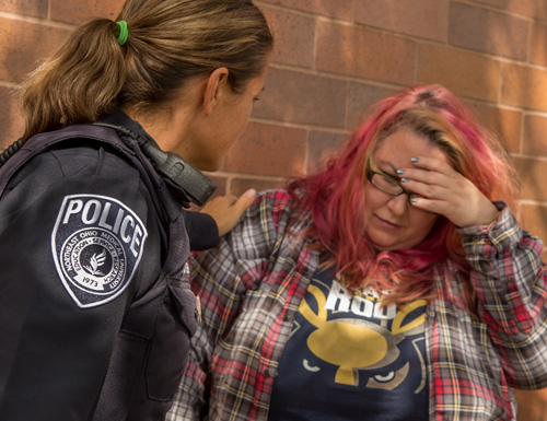 police-500 NEOMED Police officer comforting a distraught student.