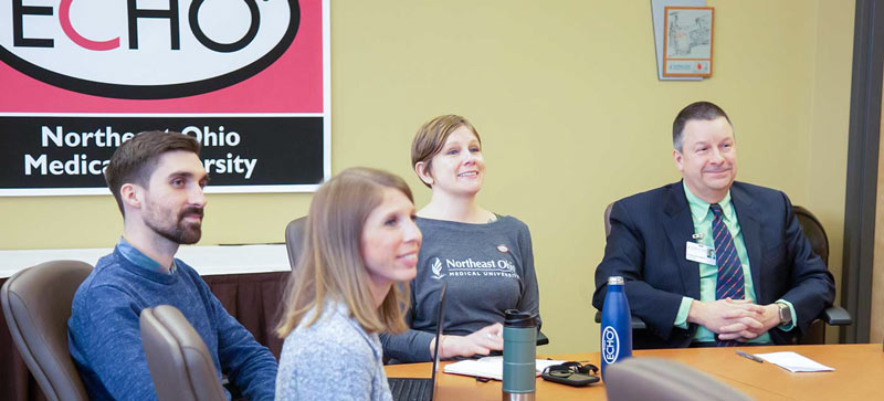 Members of the Project ECHO staff at NEOMED participate in a webinar.