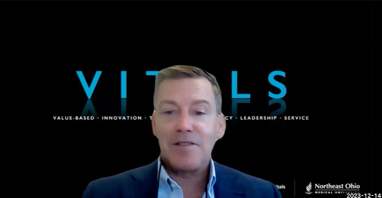 Zoom screen cap of Peter Pronovost with VITALS backdrop