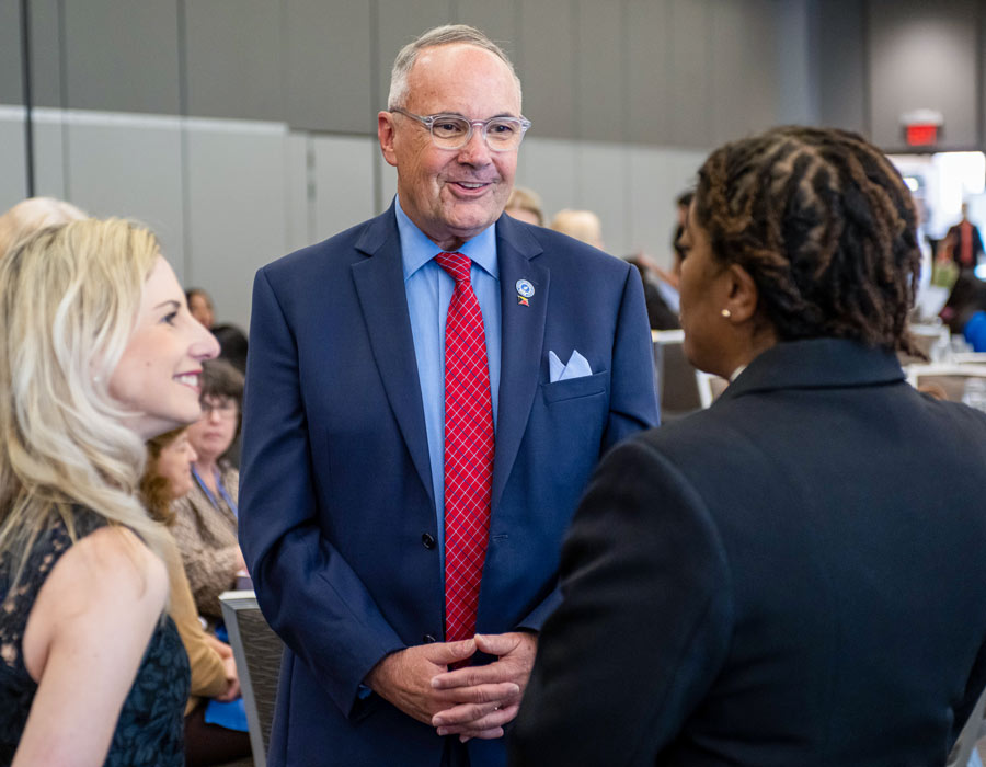 College of Medicine 2024 awards event Provost Faison chats with a student during a reception for College of Medicine students.