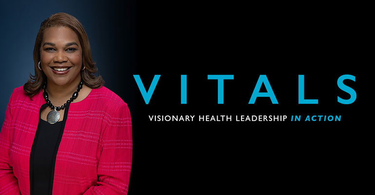 Airica Steed, Ed.D, RN, M.B.A., FACHE, president and CEO of The MetroHealth System, wears a red coat.