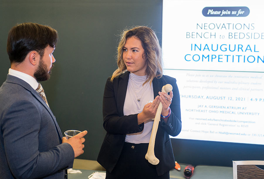 A student demonstrates an invention during a campus innovation competition.